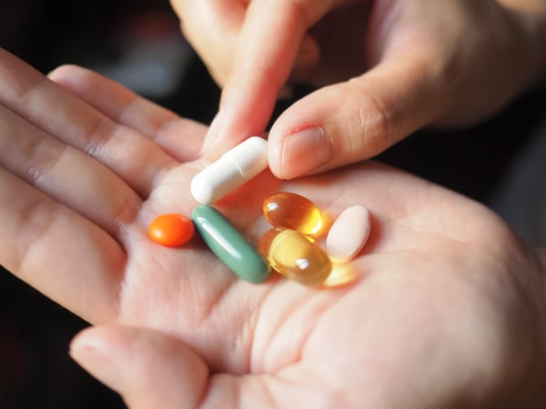 Vitamin in woman's hand